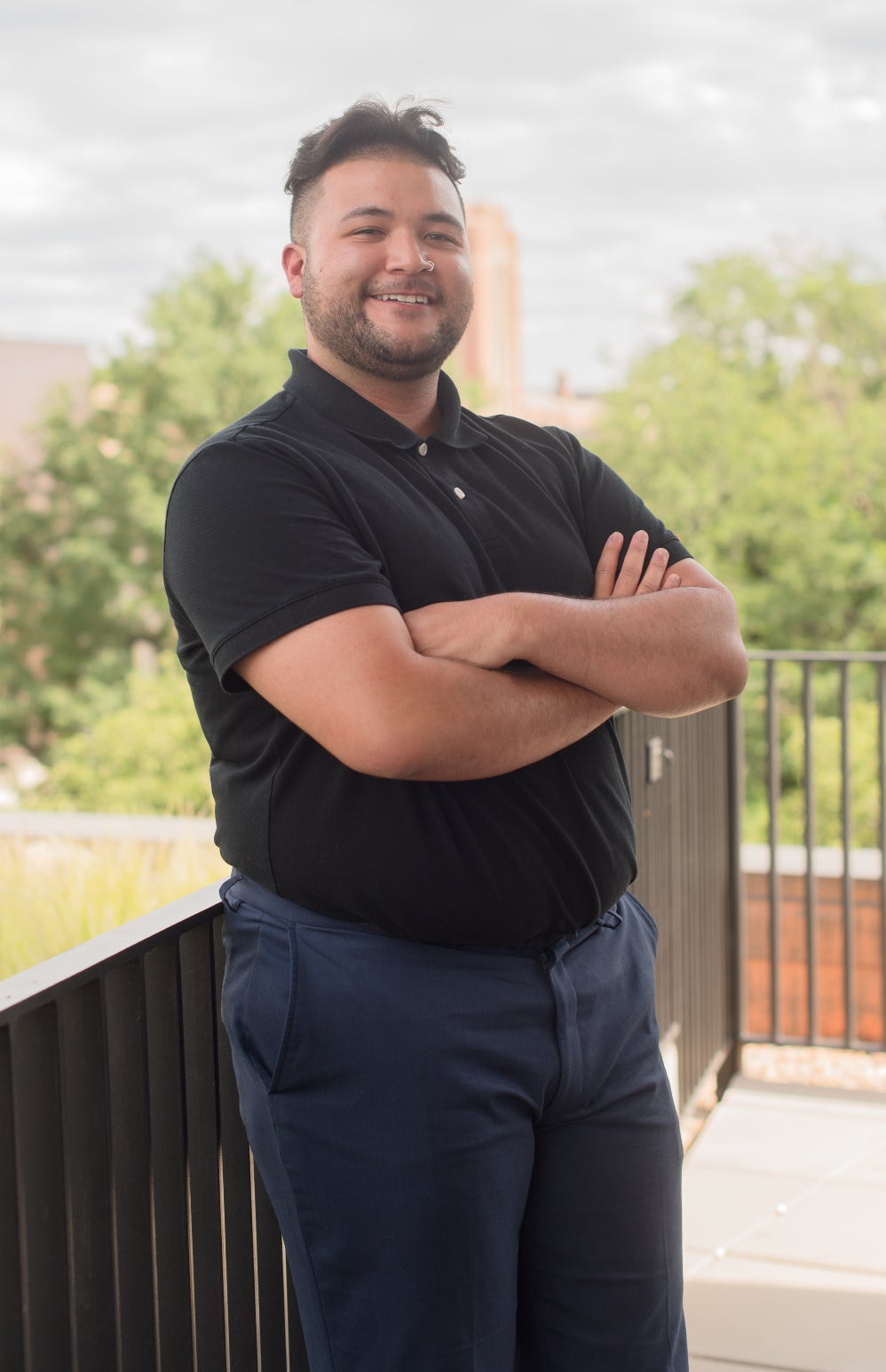 Isaiah Otero-Tercero, a male presenting individual, looking into the camera