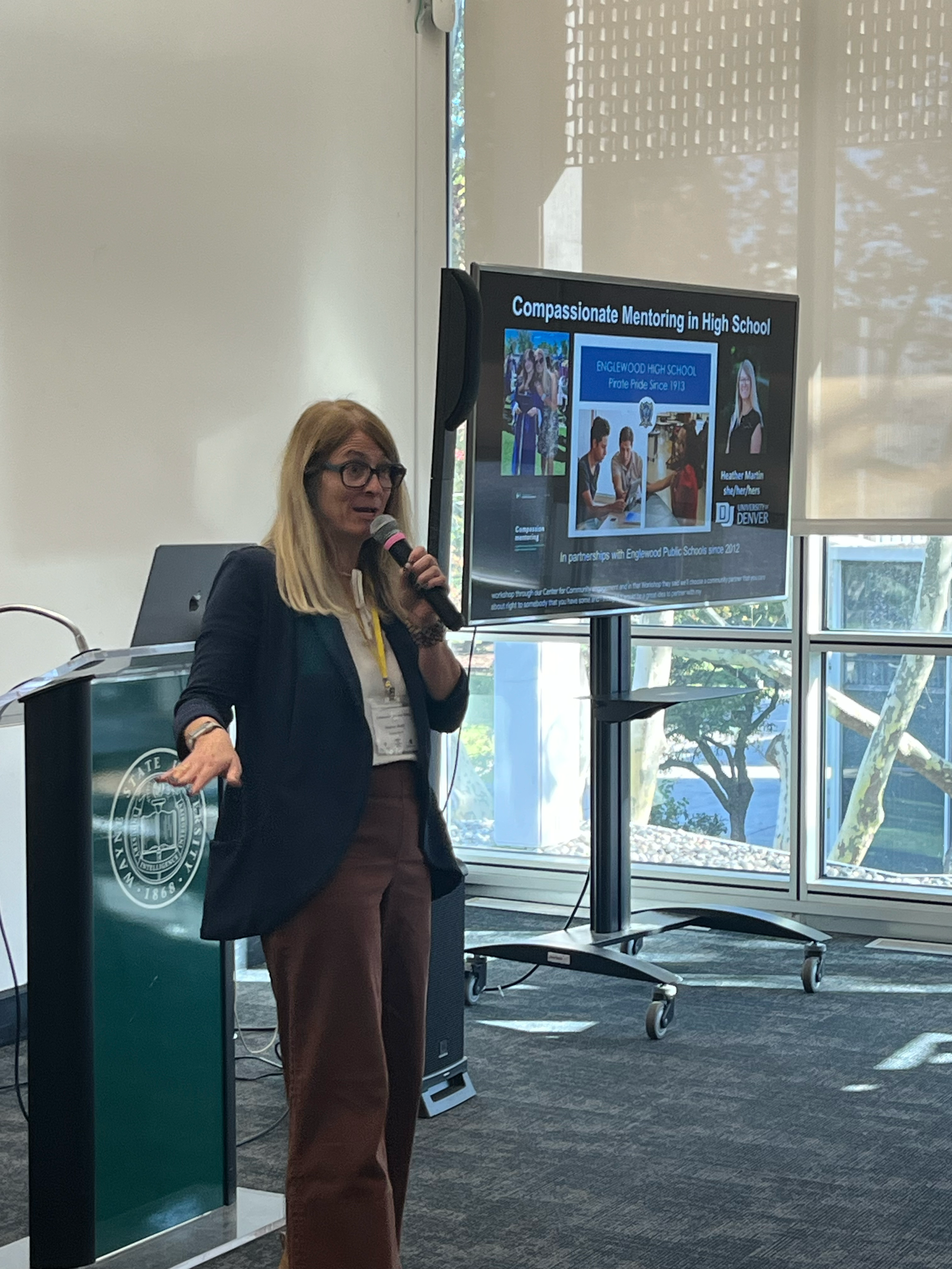 Dr.Martin conducting a presentation on compassionate teaching in High School.