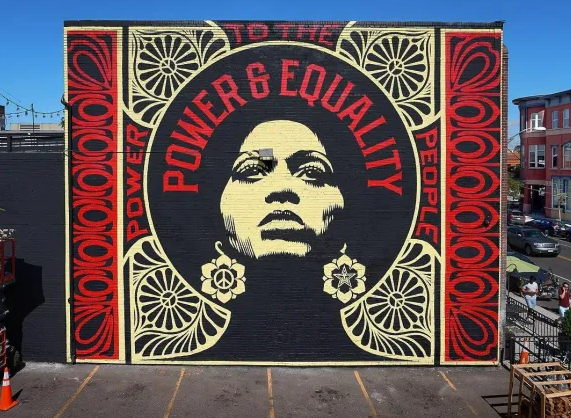 Mural of woman with words "power and equality" above her head