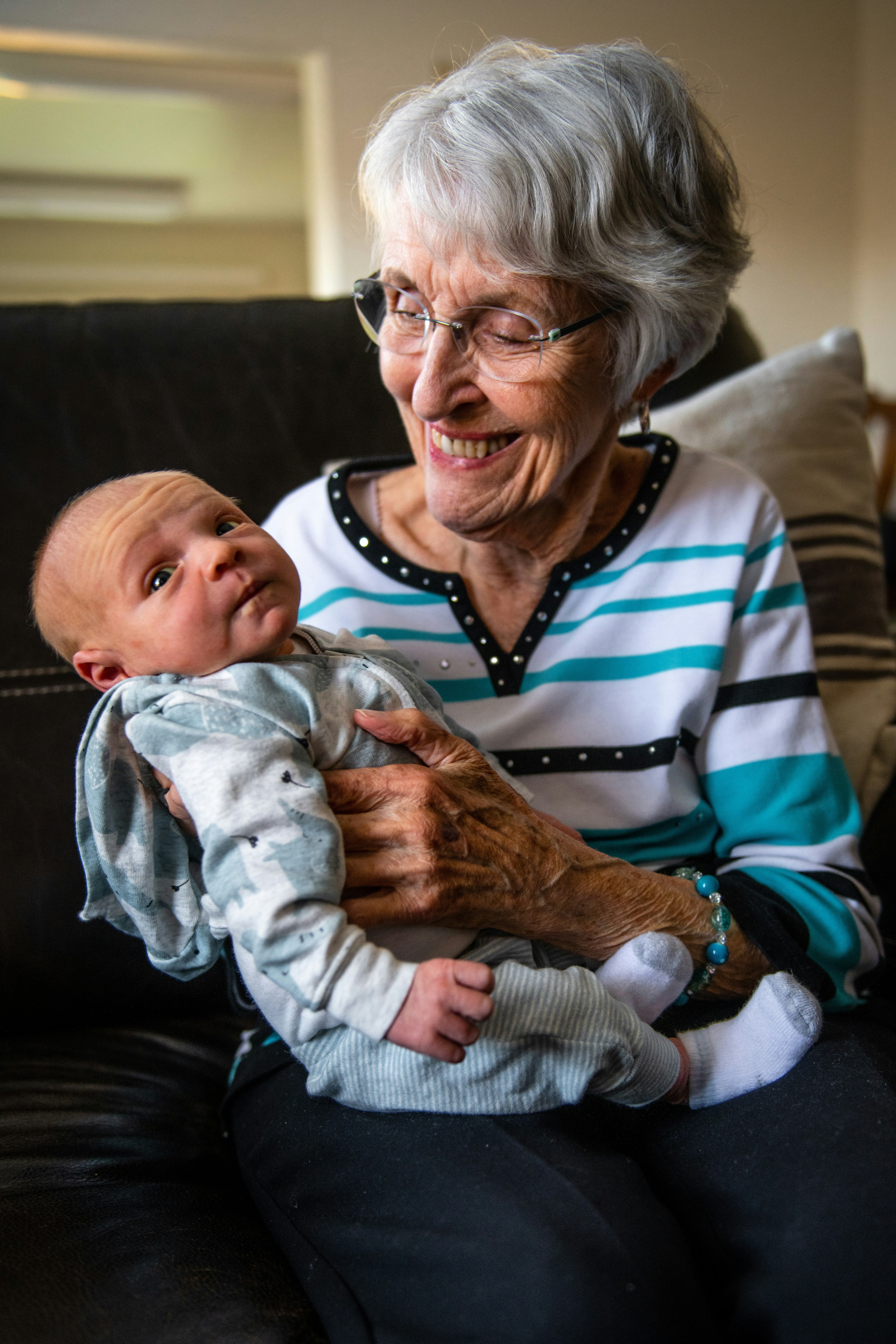 Older person holding a baby
