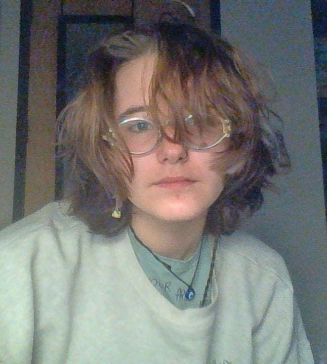 person in glasses looking at camera