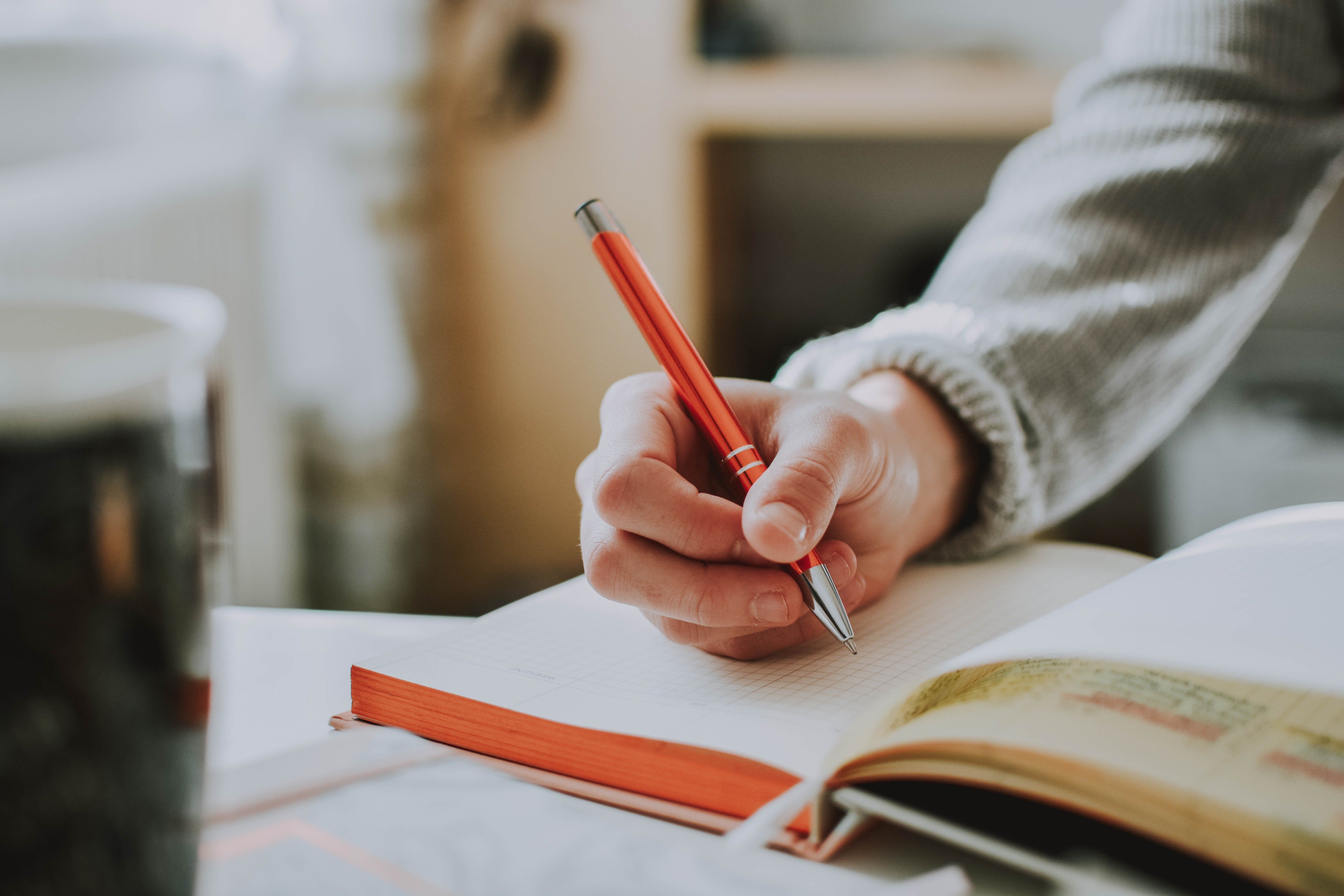 person writing on paper