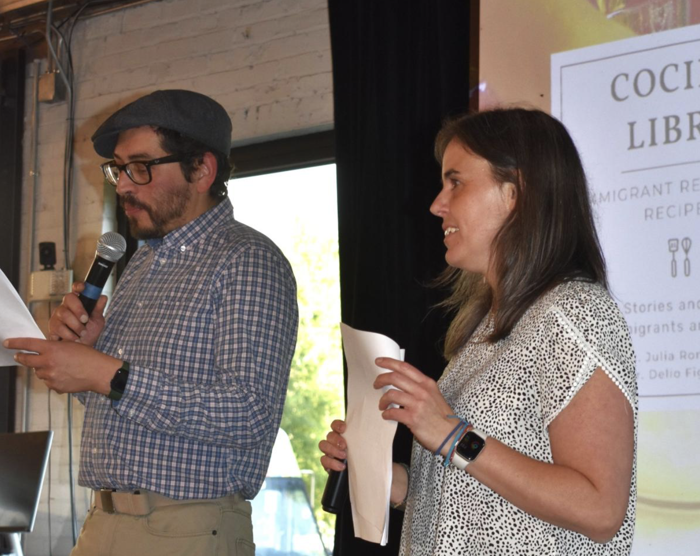 Julia Roncoroni and co-speaker giving a speech.