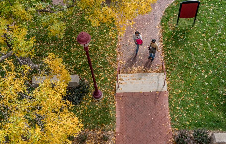 students walking on campus from high overhead
