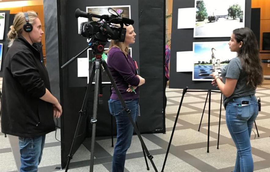 person presenting from a poster