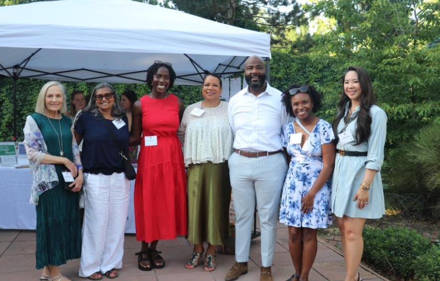 Posed photo of faculty and community partners in an outdoor photo.