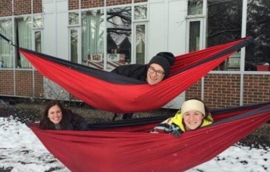 Students in hammocks outside during winter weather