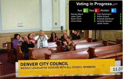 Screenshot of community members celebrating at Denver City Council meeting