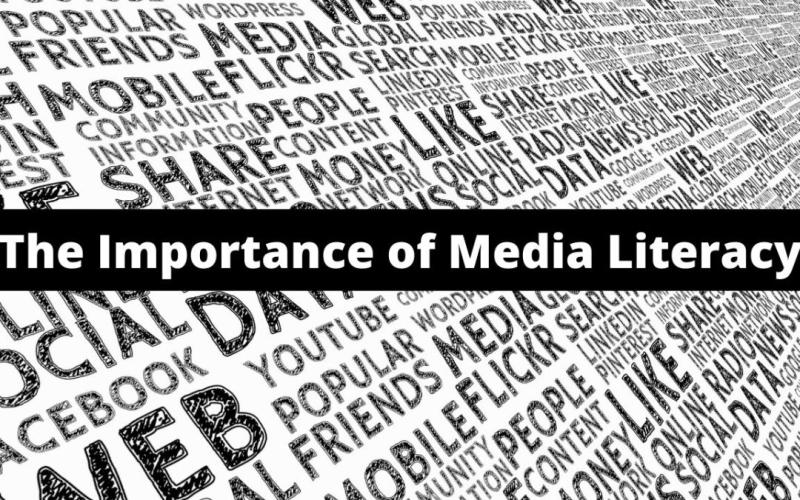 A black and white graphic featuring the bold title "The Importance of Media Literacy" centered on a black bar. The background is filled with various media-related words like "social," "media," "web," "YouTube," "news," and "share" arranged in a dynamic, diagonal pattern. The design emphasizes the complexity and saturation of modern media environments.