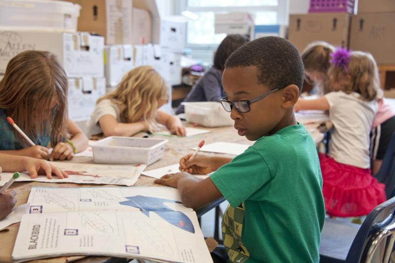 Children sitting at desks in a classroom