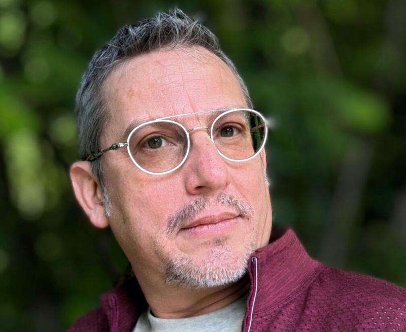 man with glasses looking at camera