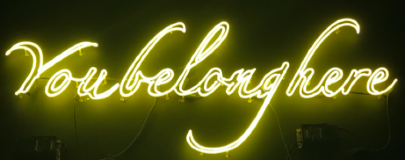 neon sign that says "you belong here"