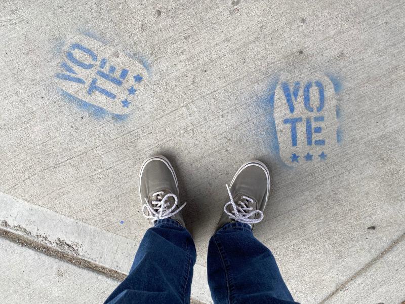 image with shoes that says 'vote'