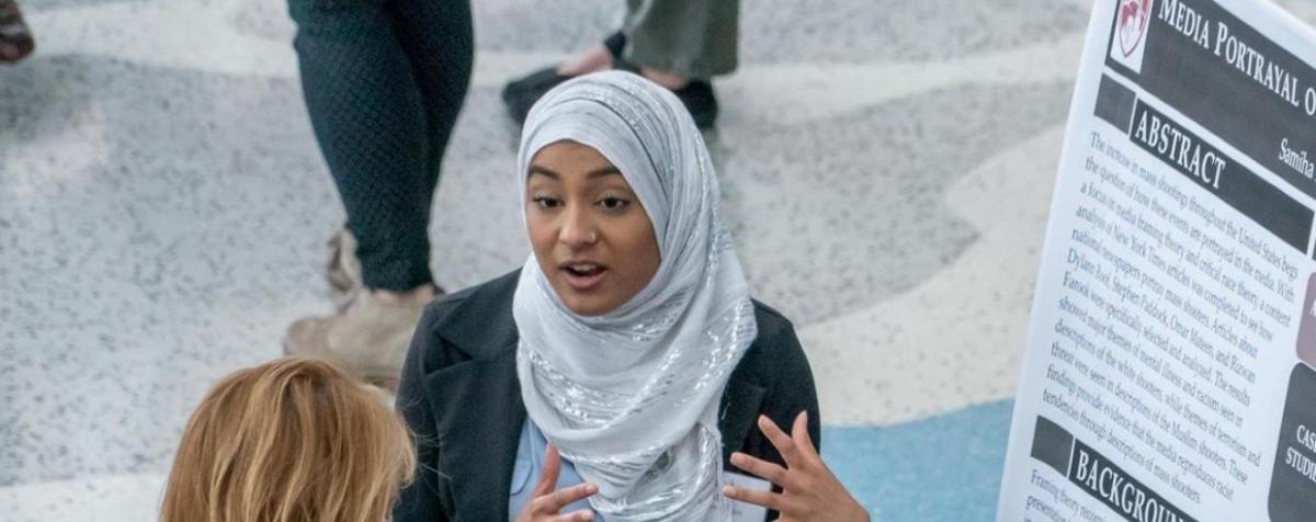 two female students talking at a networking event
