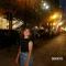 Leyna: a woman smiling on a street
