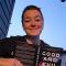 person with book grinning at camera
