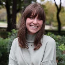 Women with brown hair smiles at camera