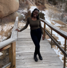 girl posing on a bridge in the snow