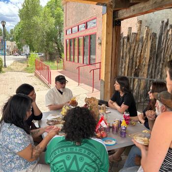 group of people sitting around a table