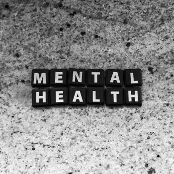 Block letters spelling out the words mental health