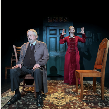 Two performers, one male and one female, acting out a scene