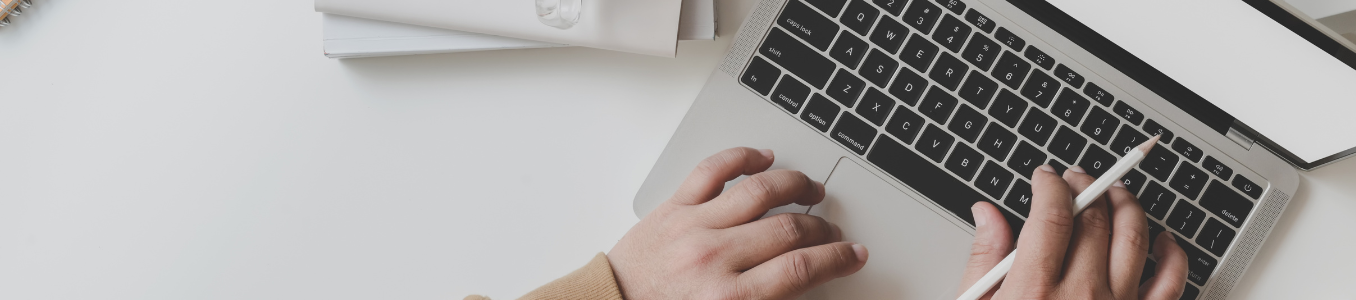 hand on a laptop computer