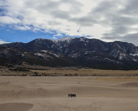 Sandy area with mountains in background